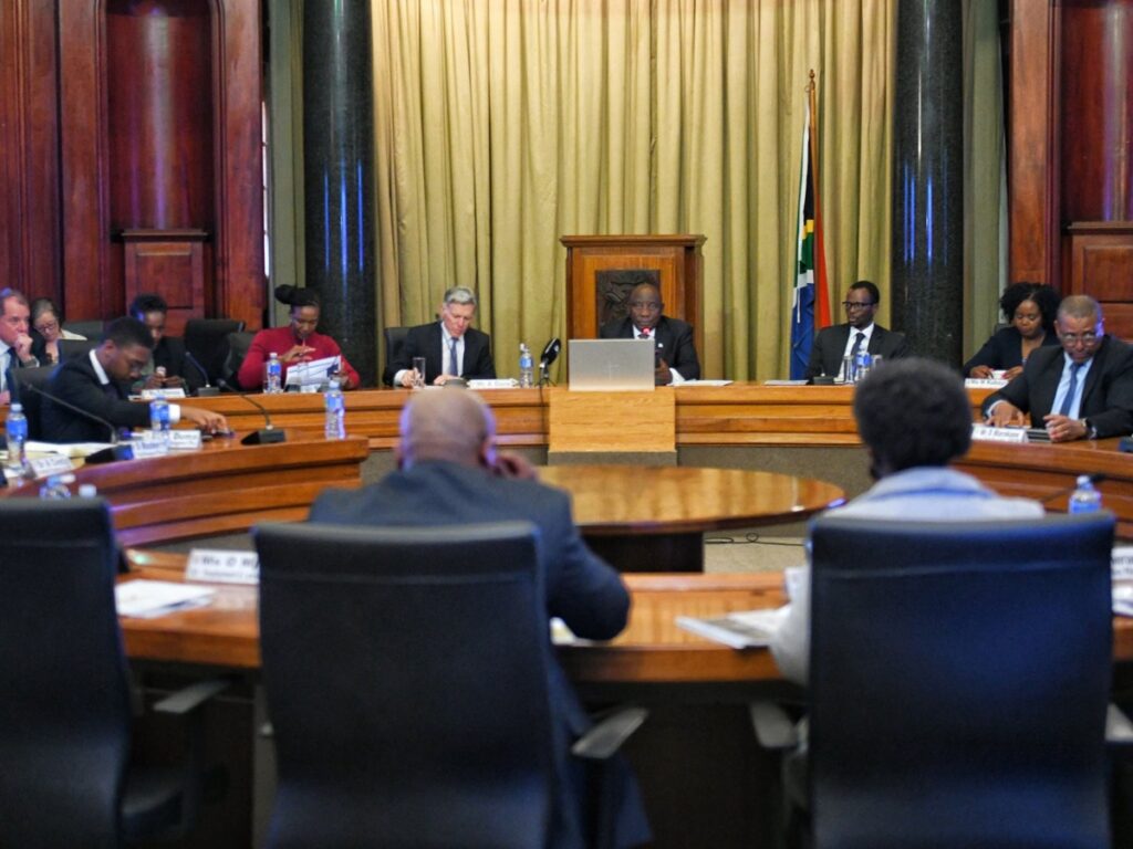 Bizwell Mutale overseeing PPP infrastructure projects with government officials, ensuring transparency and preventing corruption.